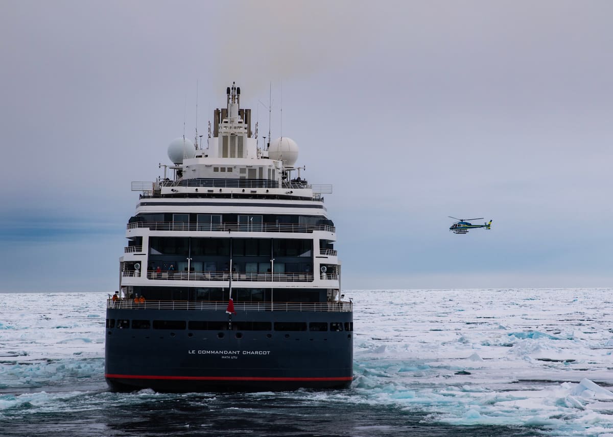 Le Commandant Charcot, Ponant's PC2 icebreaker, with helicopter, breaking through pack ice